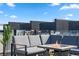Relaxing rooftop deck with comfortable seating and a cozy fire pit, ideal for enjoying city views at 5125 W 29Th Ave # 5, Denver, CO 80212