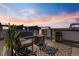 Cozy rooftop deck with fire pit, stylish seating, and beautiful sunset views at 5125 W 29Th Ave # 5, Denver, CO 80212
