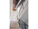 Contemporary staircase with wood steps and modern metal railing at 5125 W 29Th Ave # 5, Denver, CO 80212