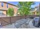 Backyard patio with outdoor seating, perfect for dining and entertaining in a private setting at 10550 Ashfield St, Highlands Ranch, CO 80126