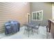 Private backyard patio with outdoor seating and grill, ideal for summer barbecues at 10550 Ashfield St, Highlands Ranch, CO 80126