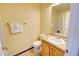 Well-lit bathroom featuring a vanity, toilet, and shower-tub combination at 10550 Ashfield St, Highlands Ranch, CO 80126