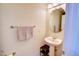 Half bathroom with sink, mirror and toilet at 10550 Ashfield St, Highlands Ranch, CO 80126