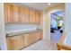 Hallway with updated cabinets and views into the primary bedroom at 10550 Ashfield St, Highlands Ranch, CO 80126