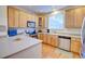 Bright kitchen with stainless steel appliances and lots of cabinets at 10550 Ashfield St, Highlands Ranch, CO 80126