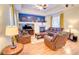 Comfortable living room with fireplace, hardwood floors, and bright natural light, creating a cozy atmosphere at 10550 Ashfield St, Highlands Ranch, CO 80126