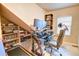 Office space with built-in bookshelves, monitors, and ample space for working from home at 10550 Ashfield St, Highlands Ranch, CO 80126