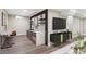 Basement entertainment area with wet bar, modern finishes, and comfortable seating at 2391 S Quitman St, Denver, CO 80219