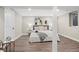 Neutral bedroom with wood flooring and ample natural light at 2391 S Quitman St, Denver, CO 80219