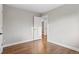 Empty bedroom with hardwood floors and freshly painted walls at 2391 S Quitman St, Denver, CO 80219