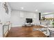 Bright and airy living room featuring hardwood floors, modern accents, and an open layout at 2391 S Quitman St, Denver, CO 80219