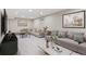 Spacious living room with neutral decor, plush sofas, and modern coffee tables at 2391 S Quitman St, Denver, CO 80219