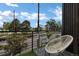 Charming balcony with city views, a cozy chair, and a small table with a potted plant for relaxation at 1534 Irving St, Denver, CO 80204