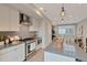 Modern kitchen featuring a central island, stainless steel appliances, and sleek, light-colored cabinets at 1534 Irving St, Denver, CO 80204