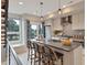 Stylish kitchen with modern island, stainless appliances, pendant lighting, and neutral cabinetry at 1534 Irving St, Denver, CO 80204
