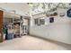 Spacious basement room with carpeted floors, a window for natural light, and a closet for storage at 3852 S Genoa Ct # B, Aurora, CO 80013