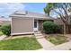 Charming home featuring a well-maintained front yard and a welcoming entrance with steps leading to the front door at 3852 S Genoa Ct # B, Aurora, CO 80013