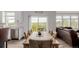 Dining area with wood table, seating for six, and sliding glass doors to the outside at 870 Mosquito Ct, Elizabeth, CO 80107