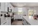 Contemporary kitchen featuring white cabinetry, stainless steel appliances, and plenty of counter space at 870 Mosquito Ct, Elizabeth, CO 80107