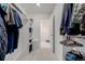 Spacious walk-in closet providing ample storage with shelving and hanging space at 870 Mosquito Ct, Elizabeth, CO 80107