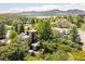 Stunning aerial view of a modern home with mountain and lake views at 6843 Fairview Dr, Boulder, CO 80303