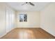 A well lit bedroom with a ceiling fan and a window at 6843 Fairview Dr, Boulder, CO 80303