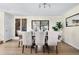 Spacious dining room with a large table, comfortable seating, and sliding doors to the outside patio at 6843 Fairview Dr, Boulder, CO 80303