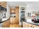 A kitchen area showing a stainless steel double oven and wood cabinets at 6843 Fairview Dr, Boulder, CO 80303