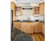 A beautifully arranged counter with glass cabinets and a stainless steel range hood above at 6843 Fairview Dr, Boulder, CO 80303