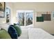 Cozy main bedroom with a bright window and colorful throw pillows at 6843 Fairview Dr, Boulder, CO 80303