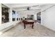 Bright sunroom featuring a pool table, skylights, and large windows offering serene views at 6843 Fairview Dr, Boulder, CO 80303