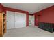 Bright bedroom with a large closet and neutral carpeting, offering a versatile living space at 8806 Tuscany Ln, Highlands Ranch, CO 80130