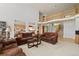 Open-concept living room with high ceilings and ample space for entertaining guests at 8806 Tuscany Ln, Highlands Ranch, CO 80130