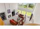 Bright and airy living room featuring a fireplace, tall windows, and golf course views at 8806 Tuscany Ln, Highlands Ranch, CO 80130