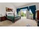 Spacious main bedroom with vaulted ceilings, sitting area, and sliding glass doors to the backyard at 8806 Tuscany Ln, Highlands Ranch, CO 80130