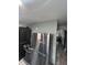 Stainless steel appliances in the kitchen including a washer/dryer, oven, and refrigerator at 3081 W 18Th Ave, Denver, CO 80204
