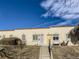 Charming townhomes with a Spanish tile roof line and steps leading to the units' front doors at 3081 W 18Th Ave, Denver, CO 80204