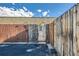 Charming front entrance through a wooden fence leading to a welcoming door, marked by unit number 308 at 3081 W 18Th Ave, Denver, CO 80204