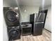 Modern black stainless steel appliances including a washer/dryer, range and refrigerator/freezer at 3081 W 18Th Ave, Denver, CO 80204