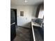A kitchen features an undermount sink and black refrigerator at 3081 W 18Th Ave, Denver, CO 80204