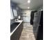 A well-lit kitchen showcasing stainless steel appliances and sleek cabinets with ample counter space at 3081 W 18Th Ave, Denver, CO 80204