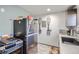 Kitchenette showcasing a stylish sink, stainless steel appliances, and modern decor at 3081 W 18Th Ave, Denver, CO 80204