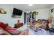Comfortable living room showcasing modern decor, plush seating, stylish coffee table, and decorative shelving at 3081 W 18Th Ave, Denver, CO 80204