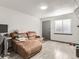 The living room features gray floors and a leather sofa next to the entrance door at 3081 W 18Th Ave, Denver, CO 80204
