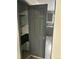 Walk in pantry and a peek of the kitchen with gray cabinetry, countertop, and sink at 3081 W 18Th Ave, Denver, CO 80204