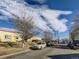 A street view shows townhomes on the left and a view to the city in the distance at 3081 W 18Th Ave, Denver, CO 80204