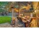 Inviting backyard patio with comfortable seating, a fire pit, and lush greenery for outdoor enjoyment at 20520 E Regency Way, Parker, CO 80138