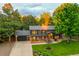 Charming two-story home with manicured lawn, mature trees, and attached two car garage at 20520 E Regency Way, Parker, CO 80138