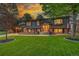 Well-maintained two-story home featuring a beautifully landscaped front yard and welcoming entrance at 20520 E Regency Way, Parker, CO 80138