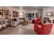 Cozy living room with stylish decor, comfortable seating, and ample natural light from a large window at 20520 E Regency Way, Parker, CO 80138